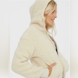 Small Ivory Zip Up Sherpa Jacket with adjustable hood and pockets.